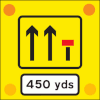 Signs used on the back of slow-moving or stationary vehicles warning of a lane closed ahead by a works vehicle. There are no cones on the road.