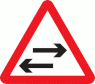 Two-way traffic crosses one-way road